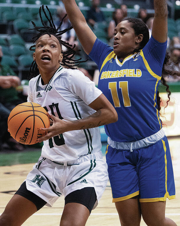 GEORGE F. LEE / GLEE@STARADVERTISER.COM
                                Hawaii’s Daejah Phillips made a move to the hoop against Cal State Bakersfield’s Lexus Green.