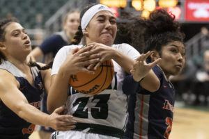 GEORGE F. LEE / GLEE@STARADVERTISER.COM
                                University of Hawaii Rainbow Wahine Meilani McBee snapped up a lore ball against the Cal State Fullerton Titans in a basketball game Saturday, Jan. 8, at SimpliFi Arena, Stan Sheriff Center.