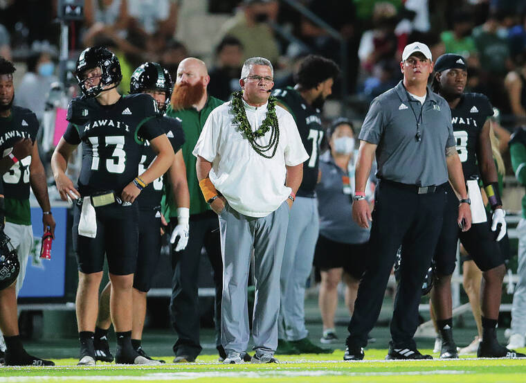 JAMM AQUINO / JAQUINO@STARADVERTISER.COM
                                Hawaii head coach Todd Graham, center, looks on from the sideline during the first half against the Colorado State Rams at the Ching Complex on Nov. 20.
