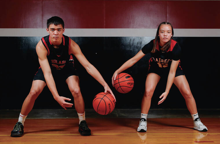 JAMM AQUINO/JAQUINO@STARADVERTISER.COM
                                ‘Iolani basketball players and siblings JJ, left, and Jaety Mandaquit have made an instant pact on the basketball court.