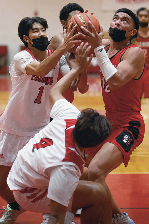 GEORGE F. LEE / GLEE@STARADVERTISER.COM
                                Kahuku’s Leonard Ah You looked for a shot while under pressure from Kalani’s Kainoa Lee and Wakea Kanahele on Wednesday at the Falcons’ gym.