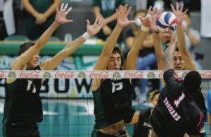JAMM AQUINO/JAQUINO@STARADVERTISER.COM
                                Hawaii outside hitter Spyros Chakas (23), right, middle blocker Max Rosenfeld (13), and opposite Dimitrios Mouchlias (11) combine to block Edward Waters opposite Evens Edouard (1) during the first set of an NCAA volleyball game on Sunday, Jan. 16, 2022, in Honolulu.