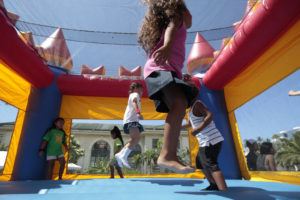 STAR-ADVERTISER
                                Kids take the opportunity to bounce at the State Capitol Grounds in Honolulu.