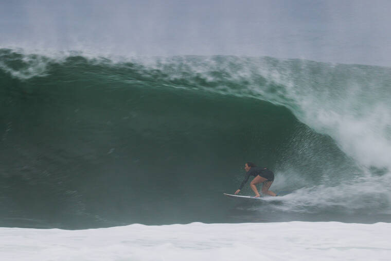COURTESY VANS
                                Hawaii’s Carissa Moore, who was announced winner of the 2021 Vans Triple Crown of Surfing women’s trophy on Monday, pulls into a big barrel at Banzai Pipeline.
