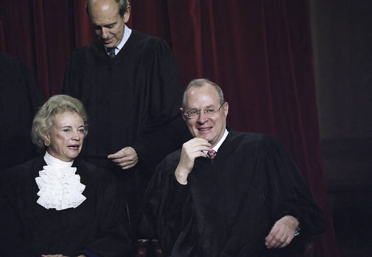 ASSOCIATED PRESS
                                Associate Supreme Court Justices Sandra Day O’ Connor and Anthony Kennedy chat as the entire court has their portrait taken on Nov. 10, 1994, in Washington.