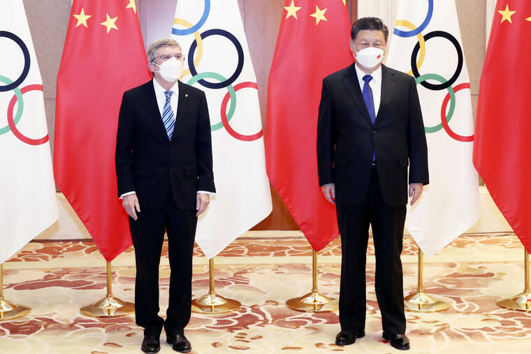 XINHUA VIA AP
                                International Olympic Committee President Thomas Bach, left, and Chinese President Xi Jinping meet at the Diaoyutai State Guesthouse in Beijing, on Jan. 25.