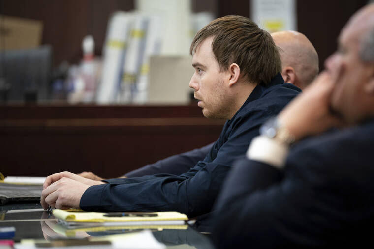 THE TENNESSEAN / POOL / AP
                                Travis Reinking listens to the closing rebuttal during his trial at the Justice A.A. Birch Building in Nashville, Tenn.