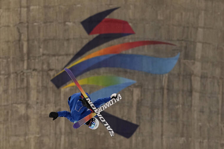 Antoine Adelisse of France competes during the men's freestyle skiing big air qualification round of the 2022 Winter Olympics, Monday, Feb. 7, 2022, in Beijing. (AP Photo/Jae C. Hong)