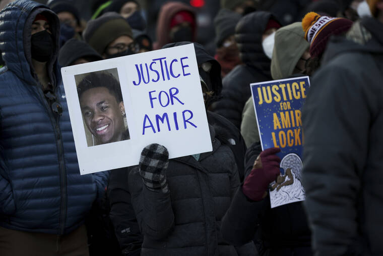ASSOCIATED PRESS / FEB. 5
                                A protester holds a sign demanding justice for Amir Locke at a rally in Minneapolis.