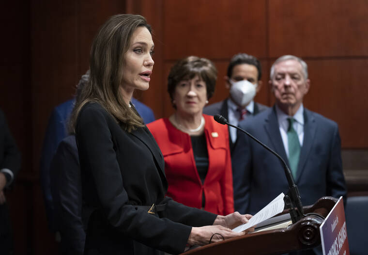 J. SCOTT APPLEWHITE / AP
                                Actress and activist Angelina Jolie, left, joins, from left, Sen. Susan Collins, R-Maine, Sen. Brian Schatz, D-Hawaii, and Senate Judiciary Chairman Dick Durbin, D-Ill., at a news conference to announce a bipartisan update to the Violence Against Women Act, at the Capitol in Washington.