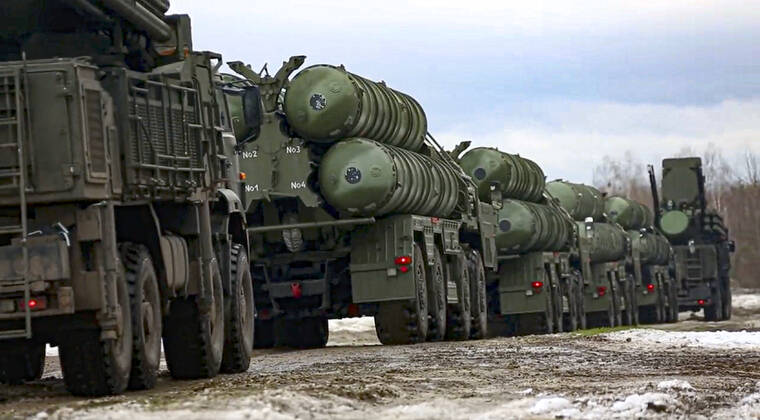 ASSOCIATED PRESS
                                In this photo taken from video provided by the Russian Defense Ministry Press Service on Thursday, combat crews of the S-400 air defense system drive to take up combat duty at the training ground in the Brest region during the Union Courage-2022 Russia-Belarus military drills in Belarus.