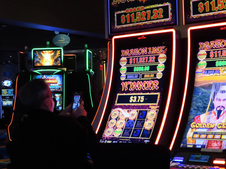 ASSOCIATED PRESS
                                A customer played a slot machine at the Ocean Casino Resort, Feb. 10, in Atlantic City N.J. The American Gaming Association released figures, today, showing that U.S. commercial casinos won $53 billion in 2021, making it the gambling industry’s best year ever.