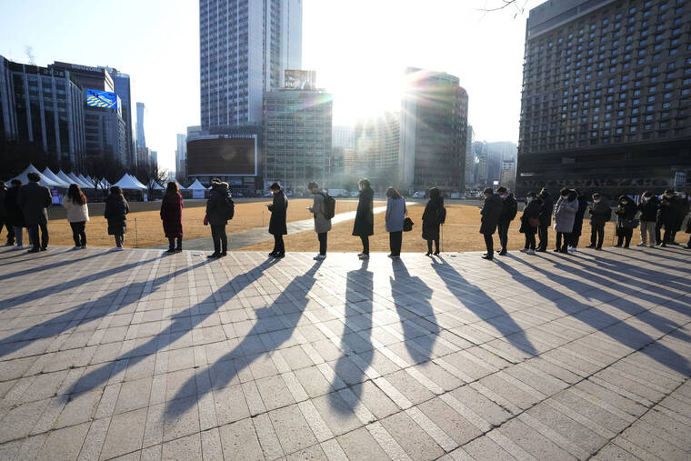 ASSOCIATED PRESS
                                People waited for their coronavirus test at a makeshift testing site in Seoul, South Korea, Wednesday.