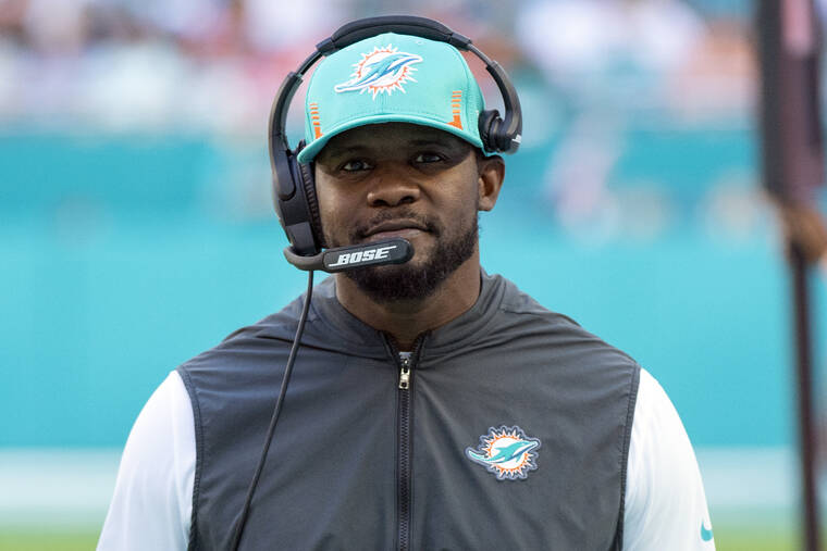 ASSOCIATED PRESS / NOV. 28
                                Miami Dolphins head coach Brian Flores smiles on the sidelines during an NFL football game against the Carolina Panthers in Miami Gardens, Fla.