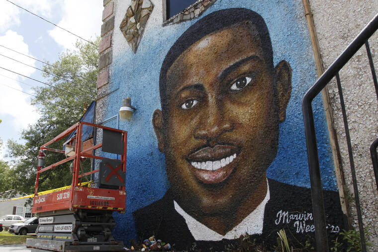 ASSOCIATED PRESS
                                A mural depicting Ahmaud Arbery, seen in May 2020, in Brunswick, Ga. The three white men convicted of murder in Ahmaud Arbery’s fatal shooting were found guilty of federal hate crimes today for violating Arbery’s civil rights and targeting him because he was Black.