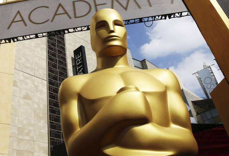 INVISION / AP
                                An Oscar statue appears outside the Dolby Theatre for the 87th Academy Awards in Los Angeles.