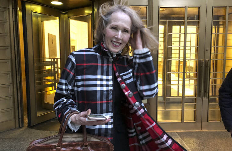 LARRY NEUMEISTER / AP
                                Columnist E. Jean Carroll leaves federal court Tuesday in New York.