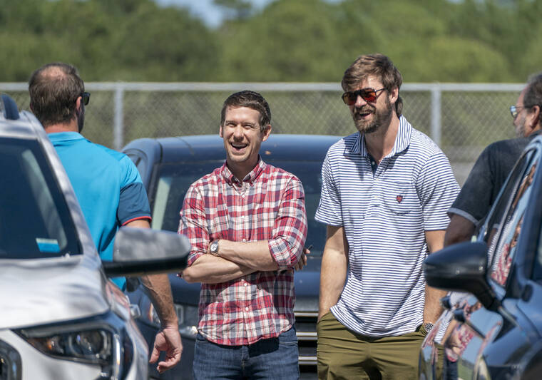 THE PALM BEACH POST VIA AP
                                New York Mets’ Max Scherzer, back to camera at left, former player Kevin Slowey, center, and former St. Louis Cardinals’ Andrew Miller arrive for baseball contract negotiations at Roger Dean Stadium in Jupiter, Fla., today.