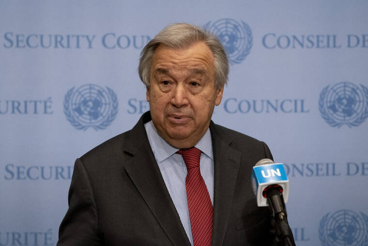 JOHN MINCHILLO / AP
                                U.N. Secretary-General Antonio Guterres speaks to members of the media outside the Security Council chamber at United Nations Headquarters.