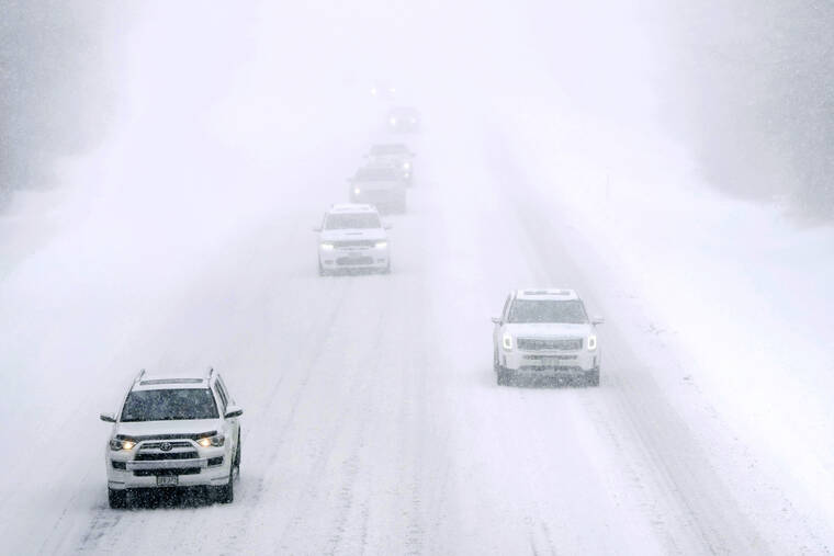 ASSOCIATED PRESS
                                Cars drove on snow-covered Interstate 495 North in nearly whiteout conditions during a winter storm in Haverhill, Mass., today. Parts of New England are expected to receive about a foot of snow from the storm.