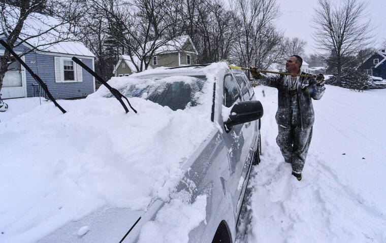 KRISTOPHER RADDER /THE BRATTLEBORO REFORMER VIA ASSOCIATED PRESS
                                Chris Pratt, a Brattleboro, Vt., resident, cleared his vehicle off during a snowstorm that hit the area today.