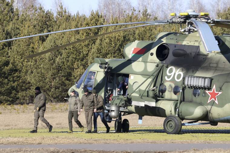 SERGEI KHOLODILIN/BELTA POOL PHOTO VIA ASSOCIATED PRESS
                                The Ukrainian delegation left a Belarusian military helicopter upon their landing in the Gomel region, Belarus, today. The Russian and Ukrainian delegations met for their first talks today. The meeting is taking place in the Gomel region on the banks of the Pripyat River.