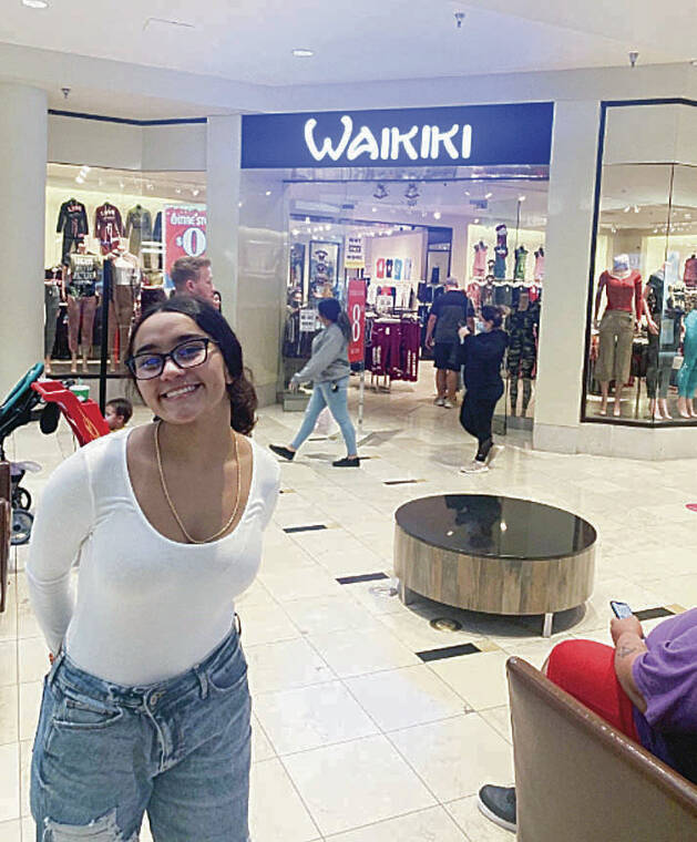 Wahiawa resident Jacie Chaviera posed in front of the Waikiki outlet at the Penn Square Mall in Oklahoma City in December. Photo by Jay Chaviera.