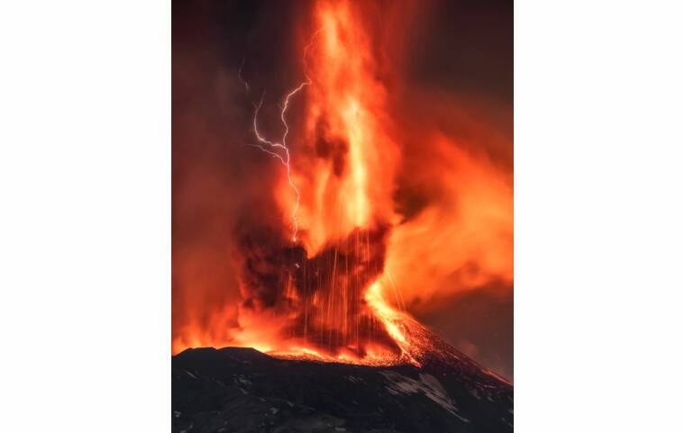 ASSOCIATED PRESS
                                A volcanic thunderstorm over Mt. Etna, Sicily, Italy, generated volcanic lightning during an eruption, early today. Colliding particles of volcanic ash generate static electricity that discharges within the volcanic plume.