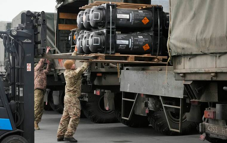 ASSOCIATED PRESS
                                Ukrainian servicemen loaded Javelin anti-tank missiles, delivered as part of the United States of America’s security assistance to Ukraine, into military trucks at the Boryspil airport, outside Kyiv, Ukraine, today.