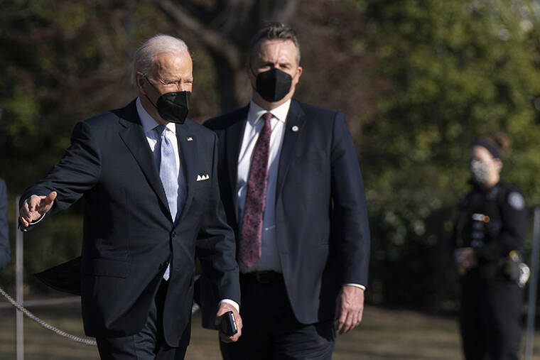 ASSOCIATED PRESS / FEB. 11
                                President Joe Biden walks to board Marine One on the South Lawn of the White House in Washington to travel to Camp David, Md.