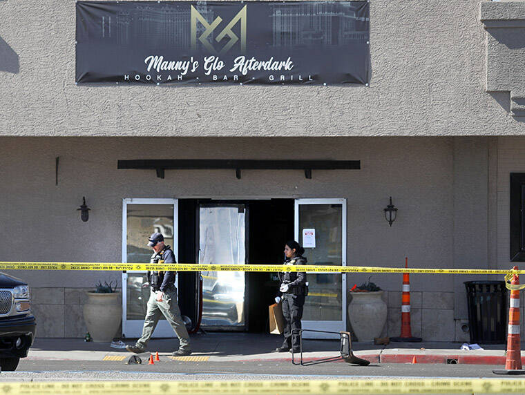 LAS VEGAS REVIEW-JOURNAL / AP
                                Las Vegas police investigate at Manny’s Glow Ultra Lounge & Restaurant, after a shooting in Las Vegas.