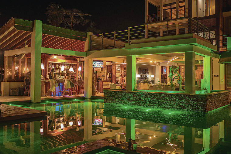NEW YORK TIMES
                                Lotus, the poolside bar and restaurant at Xbalanque, in Roatan, Honduras.