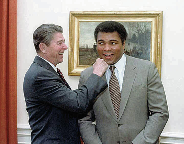 COURTESY RONALD REAGAN LIBRARY / 1983 
                                President Ronald Reagan jokes with boxer Muhammad Ali. Gloria Young said she met Ali at the East-West Center and that he had very large, warm, rough hands.