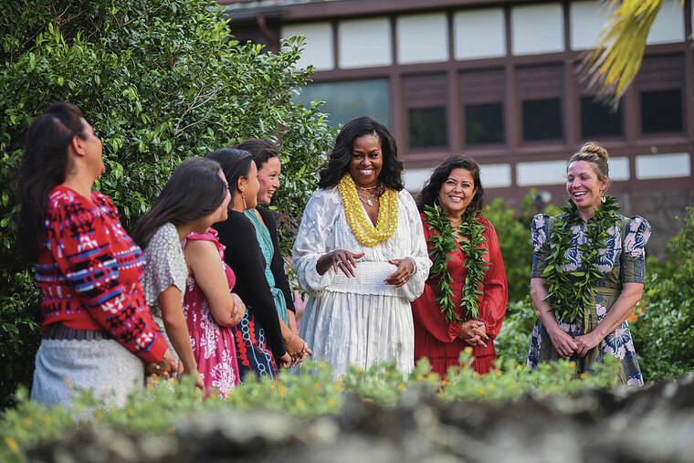 COURTESY OBAMA FOUNDATION                                 Michelle Obama, center, Maya Soetoro-Ng, second from right, and Tiffany Drake, right, visited the garden at Manoa Heritage Center with several Oahu girls Tuesday before a roundtable discussion. 