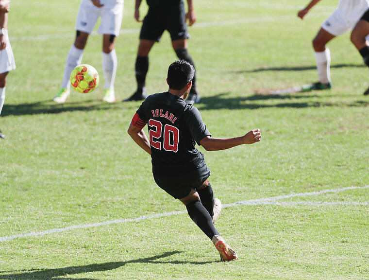 JAMM AQUINO / JAQUINO@STARADVERTISER.COM
                                ‘Iolani’s Jaxon Kahawai booted in a free kick for a goal against Kamehameha, then celebrated with teammates Tuesday at ‘Iolani.
