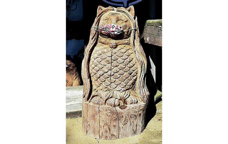 JAPAN NEWS-YOMIURI
                                A cat sculpture modeled after the mythical amabie, said to protect against pandemics, stands at the gate of Unrin Temple.