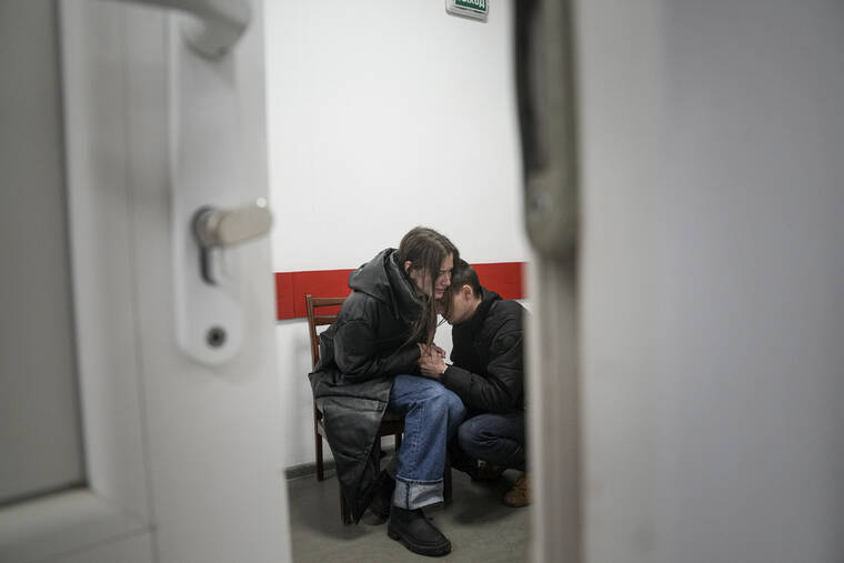 ASSOCIATED PRESS / MARCH 4
                                Marina Yatsko and her boyfriend Fedor comfort each other after her 18-month-old son Kirill was killed by shelling in a hospital in Mariupol, Ukraine.