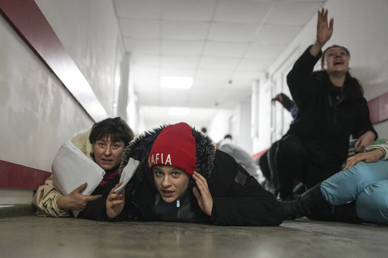 ASSOCIATED PRESS / MARCH 4
                                People lie on the floor of a hospital during shelling by Russian forces in Mariupol, Ukraine.