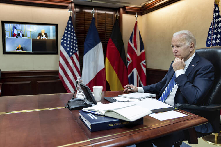 ADAM SCHULTZ/THE WHITE HOUSE VIA ASSOCIATED PRESS
                                President Joe Biden listened during a secure video call with French President Emmanuel Macron, German Chancellor Olaf Scholz and British Prime Minister Boris Johnson in the Situation Room at the White House, Monday, in Washington.