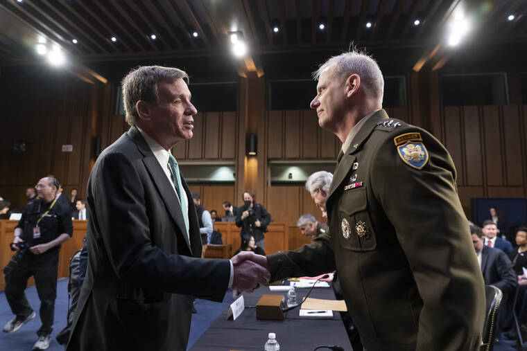 ASSOCIATED PRESS
                                Senate Intelligence Committee Chairman Mark Warner, D-Va., left, greets Defense Intelligence Agency Director Lt. Gen. Scott Berrier, right, at the start of a hearing on worldwide threats as Russia continues to attack Ukraine, at the Capitol in Washington today.