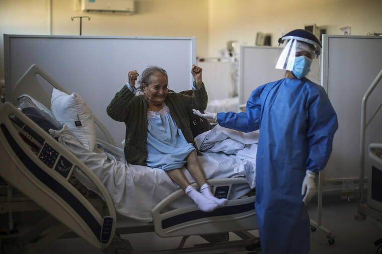 ASSOCIATED PRESS
                                Blanca Ortiz, 84, celebrates after learning from nurses that she will be dismissed from the Eurnekian Ezeiza Hospital, on the outskirts of Buenos Aires, Argentina, on Aug. 13, 2020, several weeks after being admitted with COVID-19.