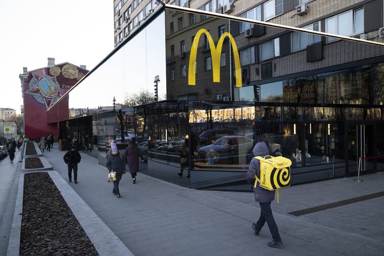 ASSOCIATED PRESS / MARCH 9
                                People walk past a McDonald’s restaurant in the main street in Moscow, Russia.