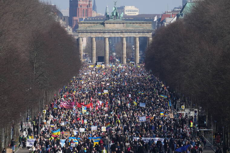ASSOCIATED PRESS
                                People attend a pro-Ukraine protest rally in Berlin, Germany, today.