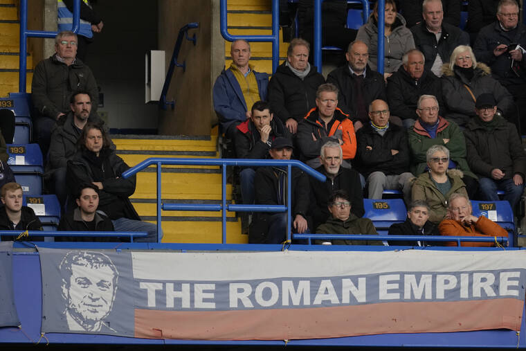 ASSOCIATED PRESS / MARCH 13
                                A banner in the colors of Russia’s national flag depicting Chelsea soccer club owner Roman Abramovich and reading “the Roman Empire” is shown during the English Premier League soccer match between Chelsea and Newcastle United at Stamford Bridge stadium in London.