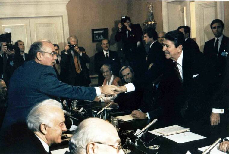 ASSOCIATED PRESS / 1985
                                FILE - Soviet leader Mikhail Gorbachev, left, shakes hands with U.S. President Ronald Reagan at the Geneva conference in November 1985.