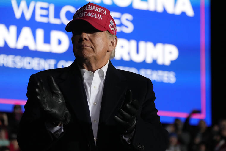 ASSOCIATED PRESS Former President Donald Trump arrived at a rally, March 12, in Florence, S.C. Trump sued Hillary Clinton, the Democratic Party and several others, alleging a vast conspiracy to malign his character and cast doubt on the legitimacy of his 2016 election win.