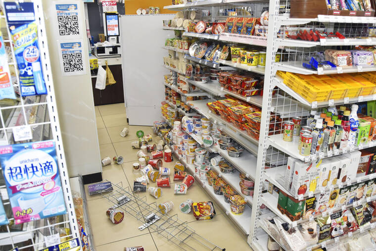 KYODO NEWS VIA AP
                                Products are scattered at a convenience store in Fukushima, Japan.