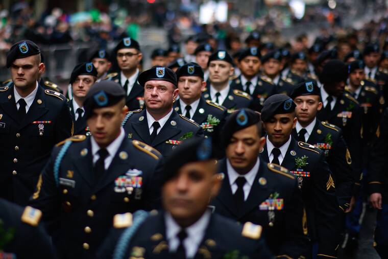 ASSOCIATED PRESS
                                Military members marched to their position before marching up Fifth Avenue during the St. Patrick’s Day Parade, today, in New York. St. Patrick’s Day celebrations across the country are back after a two-year hiatus, including the nation’s largest in New York City, in a sign of growing hope that the worst of the coronavirus pandemic may be over.