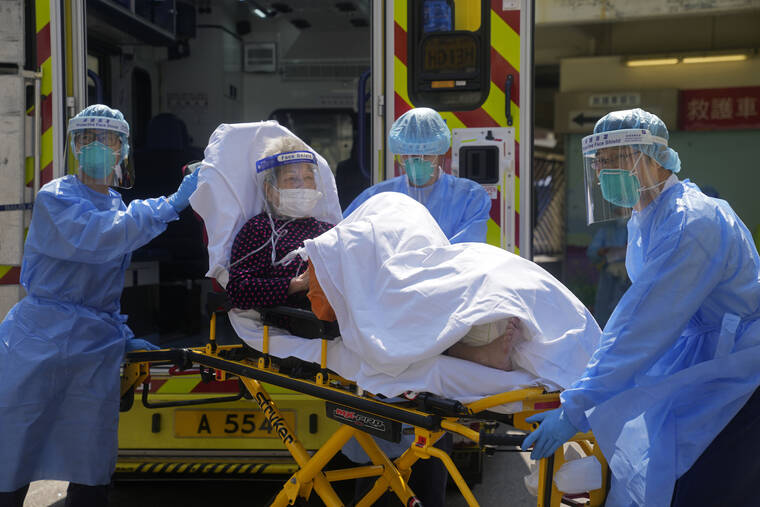 ASSOCIATED PRESS
                                Medical workers wearing protective gear moved an elderly patient from an ambulance to a hospital in Hong Kong, Friday. Hong Kong’s total coronavirus infections exceeded 1 million on Friday, amid a widespread outbreak and thousands of deaths in recent weeks.