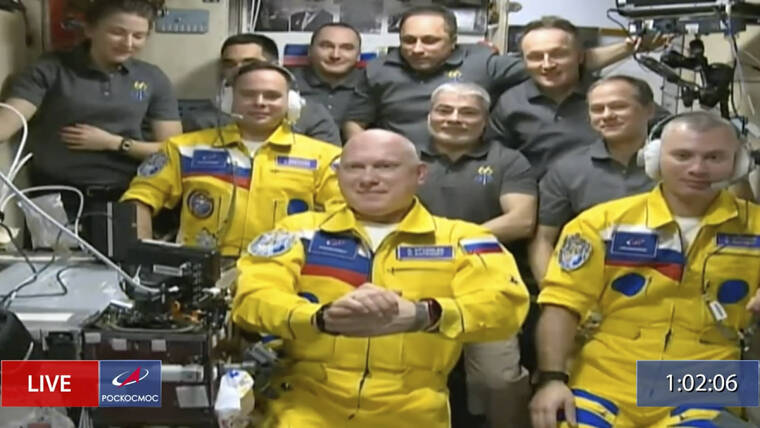 ROSCOSMOS / AP
                                In this frame grab from video provided by Roscosmos, Russian cosmonauts Sergey Korsakov, Oleg Artemyev and Denis Matveyev are seen during a welcome ceremony after arriving at the International Space Station, the first new faces in space since the start of Russia’s war in Ukraine.